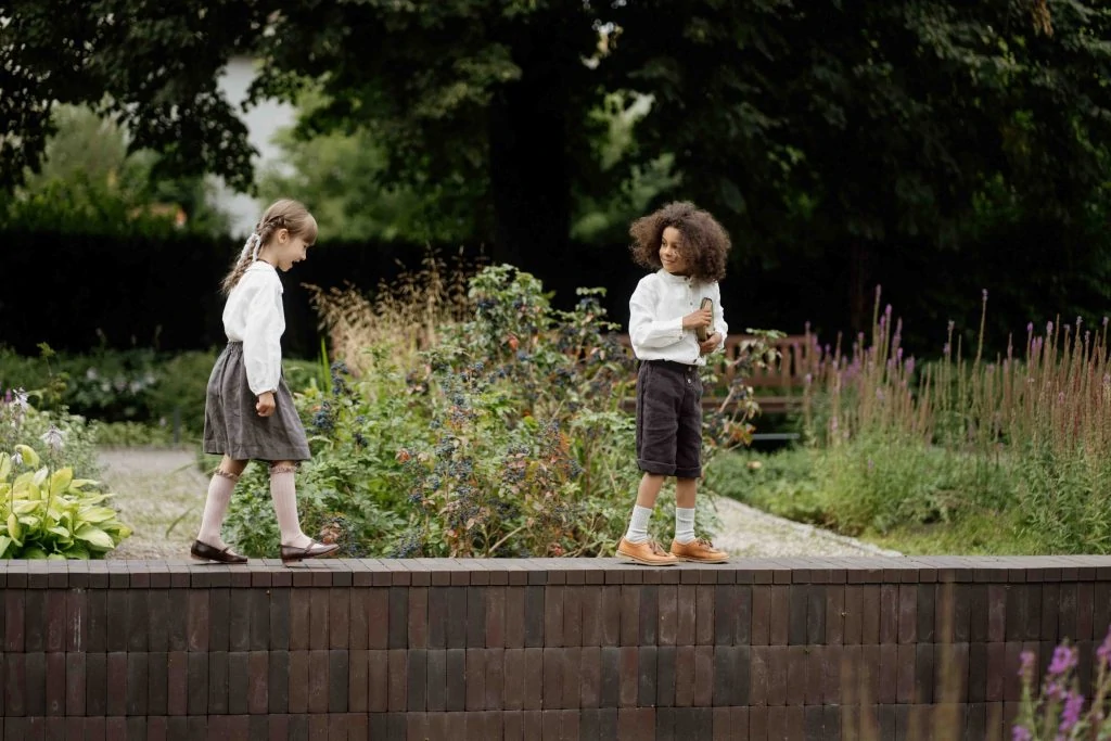 Children wearing La Petite Alice clothing.